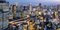 Osaka big city lights from above skyline with skyscraper panorama at twilight in Japan Royalty Free Stock Photo