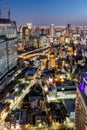 Osaka big city lights from above skyline with skyscraper portrait format at twilight in Japan Royalty Free Stock Photo