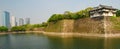 Osaka castle moat and skyscrapers Royalty Free Stock Photo