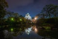 Osaka Castle with reflection in pond and night sky with star at Osaka Japan. Asia