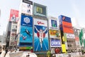 Unidentified people tourist walking around of Dotonbori district surrounding of advertisements sign