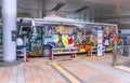 Advertising of Japanese manga Naruto in collaboration with Nijigen no Mori theme park on a bus.