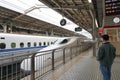 Osaka Japan - December 2, 2019: Shinkansen or bullet train arriving on a boarding platform at Shin-Osaka station Royalty Free Stock Photo