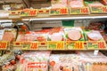 Closeup hams and processed meat in packs for sale in Japan supermarket`s freezer