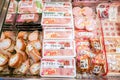 Closeup hams and processed meat in packs for sale in Japan supermarket`s freezer