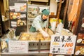 Japanese female trader and her Japanese snack `O-Den` shop.