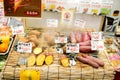 Japanese sweet potato slice and steam on bamboo grille with Japanese name and price labels.