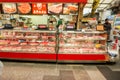 Raw sliced beef and pork display in freezer for sale with the Japanese names and label price