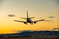 ANA Wings Boeing 737-500 landing at dusk Royalty Free Stock Photo