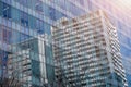 Closeup and crop reflection of buildings and bright blue sky on glass office building windows Royalty Free Stock Photo