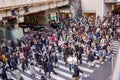 Image of many Japanese and tourist peoples walking across the street