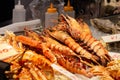 Minami Namba and Shinsaibashi area . Big shrimp and alaskan crab on seafood store at Osaka , Japan