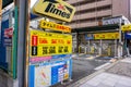 Japan time signs and prices front of coins parking lots services in urban city