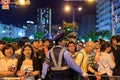 Osaka, Japan - July 25, 2015: Police officer holds back crowd of people at the Tenjin Matsuri summer festival