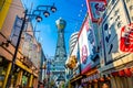 OSAKA, JAPAN - JUNE 20, 2019 :: Tsutenkaku tower located in the Shinsekai, well-known landmark of Osaka. Famous shopping streets i