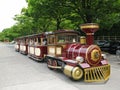 Close-up view of the trackless sightseeing tourist train in retro style near the Osaka Castle in city of Osaka, Japan.