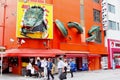 Osaka, Japan, May 2018, People huge dragon orange wall Dotonbori street