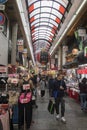 Shoppers visit Nipponbashi Kuromon Ichiba market in Osaka Japan Royalty Free Stock Photo