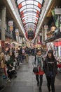 Shoppers visit Nipponbashi Kuromon Ichiba market in Osaka Japan Royalty Free Stock Photo