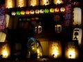 Close up picture of a golden Billiken statue and signboards of a Japanese restaurant in Osaka Royalty Free Stock Photo