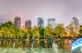 Osaka night skyline with rain and colourful umbrella, Japan