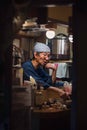 Osaka - November 02 2018: Staff in a small Izakaya restaurant a traditional japanese pub for after-work drinking next to Hozenji