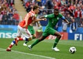 Osama Hawsawi against Russian midfielder Aleksandr Golovin Royalty Free Stock Photo