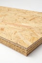 OSB board on white background showcasing natural texture and layered structure for construction and design use Royalty Free Stock Photo
