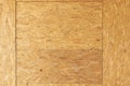 OSB boards are made of brown wood chips sanded into a wooden background. Top view of OSB wood veneer background, tight, seamless Royalty Free Stock Photo