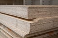 OSB sheets are stacked in a hardware store. The building material is wood. Royalty Free Stock Photo