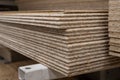 OSB sheets are stacked in a hardware store. The building material is wood. Royalty Free Stock Photo