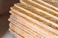 OSB slab building material made from reborn sawdust. They are stacked. Close-up Royalty Free Stock Photo