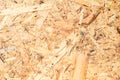 OSB surface texture and background, made of brown wood chips sanded into a wooden chipboard. Close up view of MDF Royalty Free Stock Photo