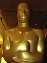Oscar statue in close up and partial silhouette Royalty Free Stock Photo