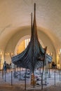 Oseberg ship excavated from ship burial archeological site, exhibited in Viking Ship Museum on Bygdoy peninsula of Oslo, Norway Royalty Free Stock Photo