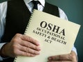 OSHA Occupational Safety & Health Act in the hand Royalty Free Stock Photo