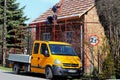 Osiek, Poland - april 18, 2018: Two builders are hiding a roof on a brick house in the village. Construction work on a small facil Royalty Free Stock Photo