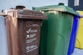 OSIJEK, CROATIA - SEPTEMBER 12, 2023: Trash bins with distinctive color codes designed to separate waste and recycle garbage in