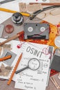 OSINT-themed creative workspace with vintage tools, handwritten notes, and press elements Royalty Free Stock Photo