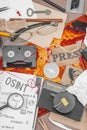 OSINT-themed creative workspace with vintage tools, handwritten notes, and press elements Royalty Free Stock Photo