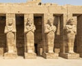 Osiride sculptures of King Ramesses III in the courtyard of his temple in the Karnak temple complex near Luxor, Egypt.