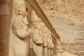 Osiris statues in row in Hatshepsut temple in Luxor