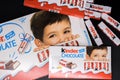 Kinder chocolate in different packages lies on a black isolated background