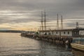 Oslo marina - dark waters of the fjord at sunset; anchored boats.