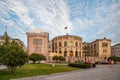 Oslo, Norway-August 1, 2013: Stortinget Parliament building Oslo Norway with beautiful fine light clouds. People rest on the