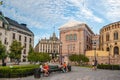 Oslo, Norway-August 1, 2013: Stortinget Parliament building Oslo Norway with beautiful fine light clouds. People rest on the