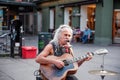 Oslo, Norway-August 1, 2013: a street musician performs on the main street of Karl Johans gate. This street is one of the busiest