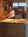 Unidentified beautiful Norwegian young woman baking bread