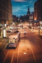 Trams running in front of Oslo train station, city night views in the business district from above