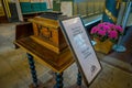 OSLO, NORWAY - MARCH, 26, 2018: Interior view of informatie sign of asking for contribution in a wooden box at the Oslo